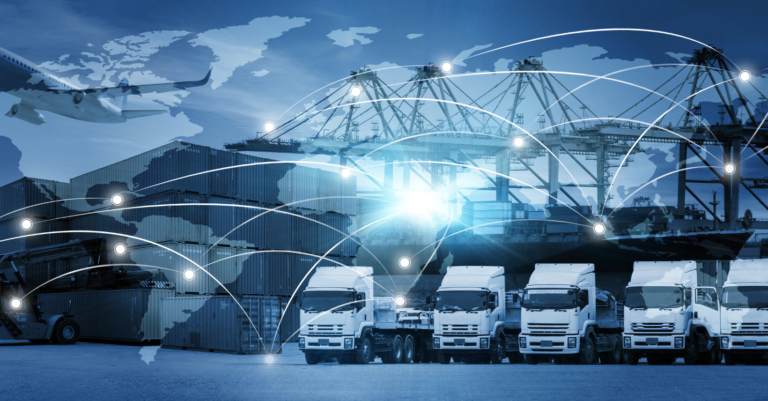 A number of trucks standing side by side